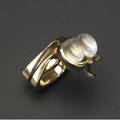 Albert paley rare and early interlocking ring set in yellow gold with two moonstone cabochons 1968