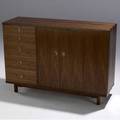 Edward wormley  dunbar  natzler walnut cabinet with prominent knuckle joints the brass pulls inset with natzler glazed ceramic tiles with five drawers and two bifold doors enclosing two drawers a