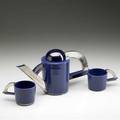 Peter shire teapot and two cups covered in blueviolet and pewter lustre glaze 1973 teapot signed and dated with artists inventory decal 90163 teapot 7 x 14 x 4