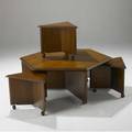 Frank lloyd wright  henredon ribbon mahogany coffee table with bookmatched veneer and taliesin carving en suite with three triangular stools on casters signed 19 x 48 x 48 and 16 12 x 22 x