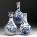 Chinese export grouping of three blue and white water bottles all with floral decoration 19th c tallest 10