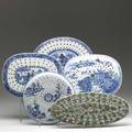 Chinese export grouping of five trivets four blue and white and one famille verte 19th c largest 16 x 7