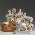 Staffordshire six animal figurines includes two spaniels two lions one zebra and one horse some with damage tallest 11
