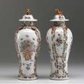 Chinese export pair of covered urns with raised decoration and foo dog finials qing dynasty ca 17501760 12 12