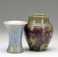 Pisgah forest two vases one corseted covered in ivory and blue crystalline glaze 1948 the other in plum and olive green several lines around rim of corseted pisgah marks corseted dated bulbous