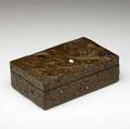 Arts  crafts fine and unusual copperclad box elaborately decorated with repousse bird of paradise against a floral background bejeweled with paste cabochons crack to wood on bottom chip to back