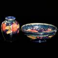 Moorcroft vase and bowl in the pomegranate pattern on indigo stamped moorcroft made in england and blue ink signatures 4 14 and 7 dia