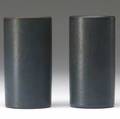 Marblehead pair of cylindrical bud vases each decorated with a stylized foliate motif in green and dark blue on a matte blue ground from the collection of arthur baggs daughter mary trowbridge ba