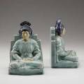 Rookwood pair of porcelain bookends designed by william p mcdonald with indonesian women in meditation covered in bright majolica glazes 1922 superficial lines on edges of one flame marksxxii23