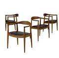 Style of hans wegner set of four walnut chairs with dark brown leather seats 29 12 x 24 12 x 20