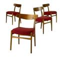 Hans wegner  fritz hansen set of four teak side chairs the seats upholstered in red textured fabric branded marks obscured by upholstery 30 12 x 20 34 x 16