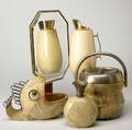 Aldo tura etc five accessory pieces three by aldo tura vase thermal carafe and tabletop mirror plus an ice bucket with integrated liner and fishshaped bowl in the style of tura first three p