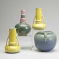 Roseville four vases a pair of yellow orian 7 12 a pink and green futura 8 12 and a blue topeo 6 latter two marked