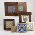Flint seven floral or heraldic tiles most by flint all framed some as trivets flint stamped most 6 sq