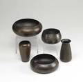 Roycroft five hammered copper vessels three bowls and two vases sickness to varnish on one bowl all but one stamped with orb  cross largest bowl 6 34