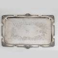 Classical revival silver plated tray ca 1870 rectangular the rim with mask and olive leaf reserves the chased surface with floral wreath and songbird motifs script monogram m 14 12 x 11 14