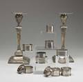 Silver grouping pair of english silver candlesticks along with nine sterl napkin rings and two silverplated napkin rings candlesticks 10 12