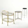 Hoegger chrome stool with black leather seat together with jansen style side table in chrome and brass with black bakelite top and an italian brass and glass bar cart table 26 20 12 dia