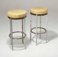 Machine age pair of chrome barstools with vinyl seats