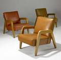 Russel wright three lounge chairs upholstered in vinyl on blonde wood frames 31 12 x 25 12 x 31 12
