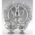 Redlich  co art nouveau silver coffee service retailed by je caldwell  co ca 1900 raised and applied daisy motif with scroll handles and ivory insulators 15 12 tray 3915 10 12 coffee