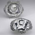Tiffany  co silver bowls two clover pattern bowls each having scrolling everted rim richly decorated with blossoms and leaves ca 1898 245 ot 2 12 x 9