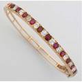 Ruby and diamond hinged bangle bracelet 18k ca 1930 twelve oval cut rubies approx 2 cts tw and eleven oec diamonds approx 2 cts tw 151 gs gw agl colored stone origin report no cs40150 s