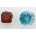 Two fine and large unmounted gemstones circular cut blue natural zircon 4486 cts 1987mm square cushion cut rhodolite 20 cts 1515mm x 157mm