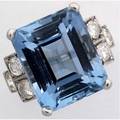 Art deco aquamarine and diamond ring platinum with emerald cut aquamarine of good color 164mm x 135mm approx 165 cts flanked by six oec diamonds 120 cts tw in square stepped settings 101