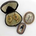 Early 19th c diamond and enamel mourning brooches and pair of victorian earrings octagonal brooch of carved ivory and gold depicting a woman and urn on a blue ground in 18k with opalescent enamel o