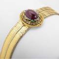 Gemset enameled gold holbeinesque bracelet 18k ca 1870 the central boss an oval garnet cabochon with rc and omc diamond crests within a frame of polychrome enamel and omc diamonds the reverse a c