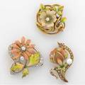 Three american art nouveau enameled gold flower brooches with diamonds ca 19101920 one pt topped by krementz 14k yg 145 gs gw largest approx 1