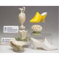 Royal worcester grouping of eight pieces includes two novelty shoes two worcester advertising pieces ewer and three assorted pieces tallest 6 34