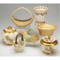 Royal worcester grouping includes two covered jars four baskets and vase all late 19thearly 20th c tallest 7 34