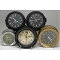 Us navy ships clocks grouping of five includes three chelsea and two seth thomas three are black composition cases one brass and one nickel on brass largest 7 34