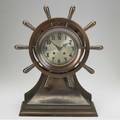Chelsea ships clock with bronze case time and strike and ships wheel decoration 17 12