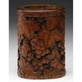 Chinese carved bamboo brush pot deeply carved with loquat berries and leaves a continuous cloud collar band around neck 19th c 5 x 3 12 x 3