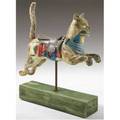 Carousel cat in the style of gustav dentzel fully carved with old surface and brass pole mounted on a greenpainted wood platform cat has a blue ribbon in its mouth second half of the 20th c 42
