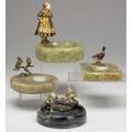 Coldpainted bronzes grouping of four includes pair of hummingbirds pair of frogs duck and a dutch girl all on hard stone ashtray bases tallest 6 12