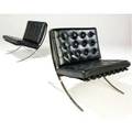 Mies van der rohe  knoll pair of barcelona chairs with black leather cushions on polished steel frames provenance seagram building one seagram label 30 x 31 x 28