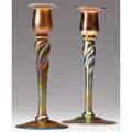Steuben pair of unusual twisted candleholders with gold and satiny blue luster both marked aurene 686 8 x 3 12