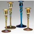 Steuben four aurene glass candlesticks with twisted shafts in blue or gold etched marks 8 14 and 10 each
