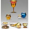 Steuben seven assorted glass pieces four cabinet vases in blue or gold aurene large stopper with spherical top break at bottom goblet small cup in sterling holder with underplate most marked t