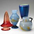 Durand four pieces two blue and yellow cluthra glass vases one flaring vase with pulled feather design brokenand one iridescent blue three marked tallest 9 12