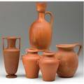 Chelsea keramic art works five bisquefired classicallyshaped vessels including a pair of urns with ring handles minor nick to shoulder of an urn each stamped ckaw tallest 8