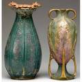 Amphora two vases the taller designed by paul dachsel with gold ladybugs on vermillion blossoms over an organic green and mauve base the other with two gilded handles and four buttressed legs mode