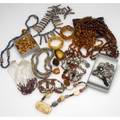 Amber and ethnic jewelry eighteen pieces includes antique and 20th c amber beads pendants and bracelets silver necklaces quartz and garnet bead necklace with 14k yg trade beads horn and gold bea