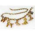 Gold poodle charm necklacebracelet 14k yg with five sculptural charms most with diamonds or rubies may be worn as a bracelet 14 12 length 708 gs