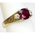 Ruby and diamond ring cushioncut ruby approx 125 cts flanked by two brilliantcut diamonds approx 24 ct tw in an 18k yg filigree mount 37 gs size 6