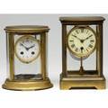 Crystal regulator clocks two brass clocks include an oval french clock with mercury pendulum tallest 9 34